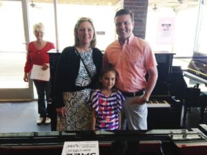 Another Family with their new Yamaha Piano