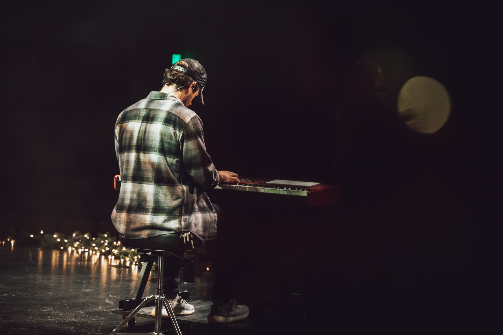 Man playing piano on stage