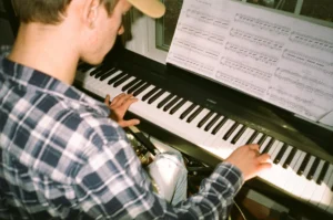 young man playing piano