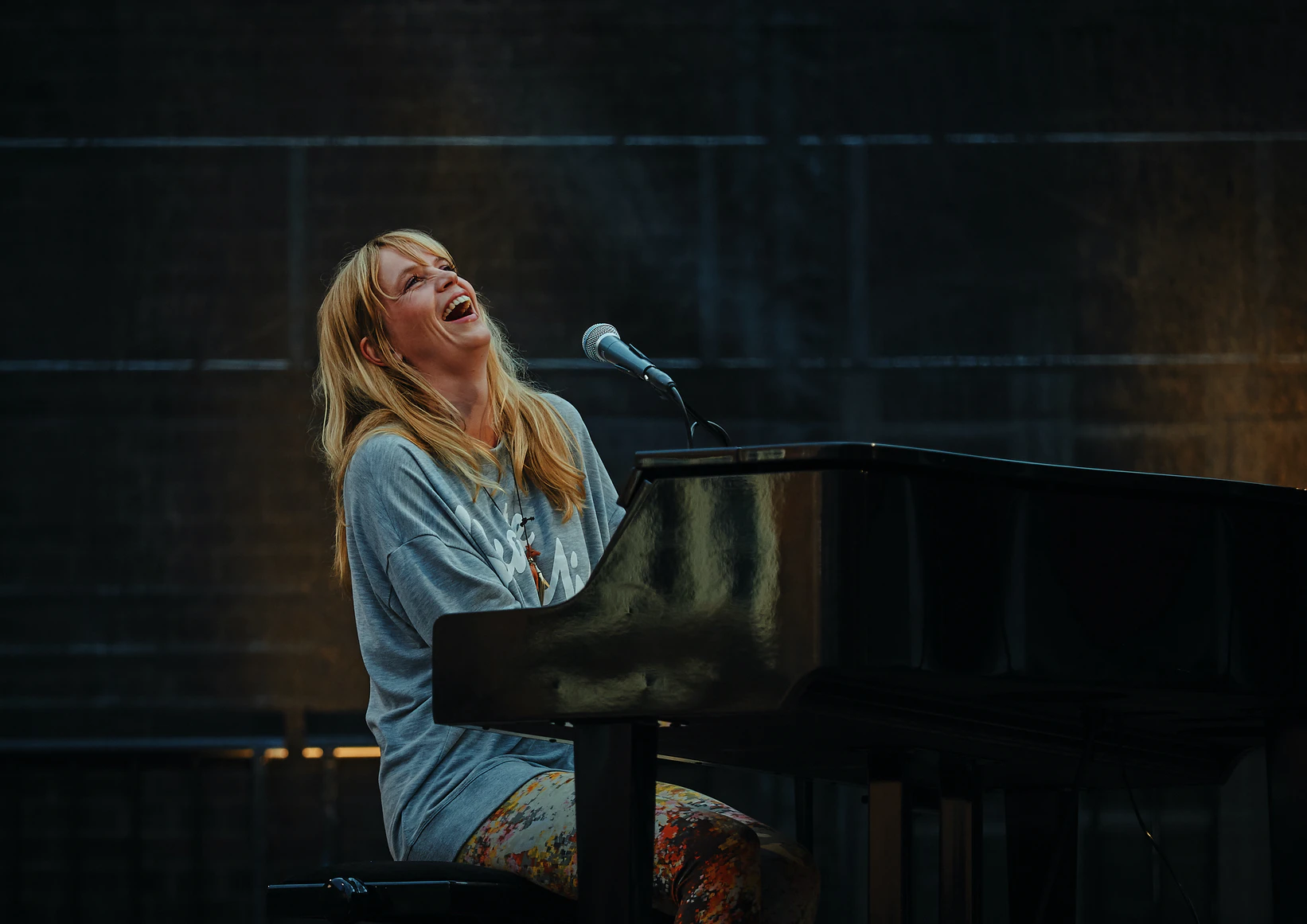 Lady Laughing at piano