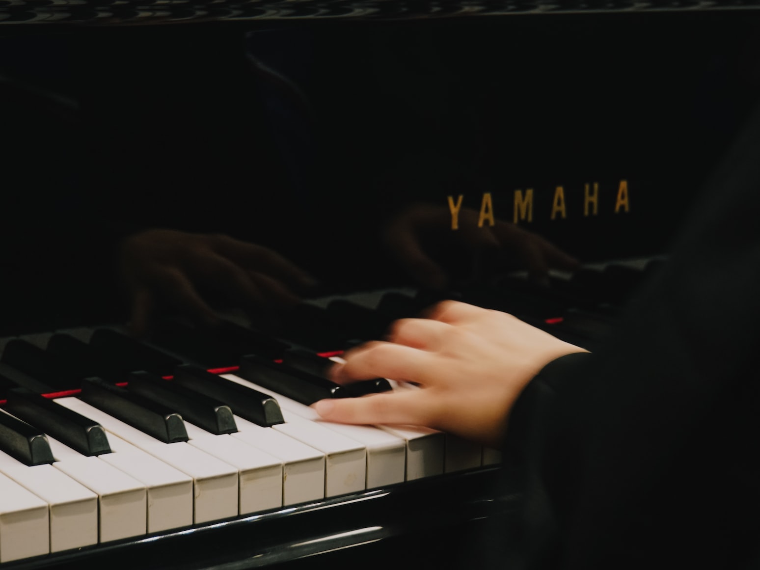 Young hands on piano