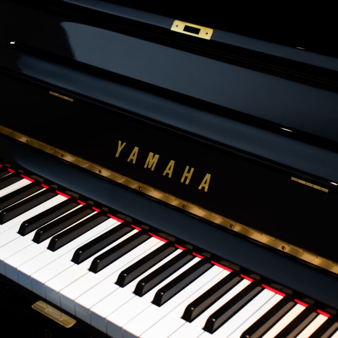 Close-up of Yamaha U3 (1987) upright piano in polished ebony at Miller Piano Specialists showroom in Nashville, TN.
