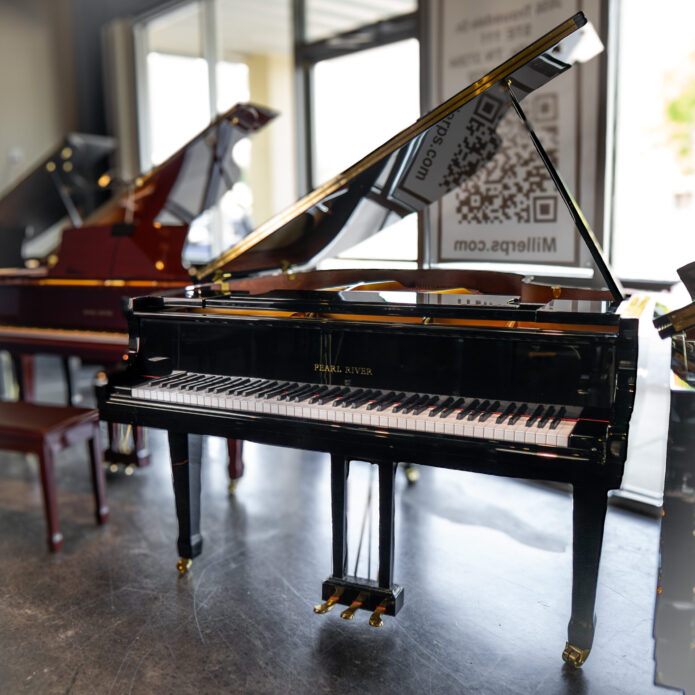 Used Pearl River GP-170 grand piano in polished ebony with open lid on display at Miller Piano Specialists showroom in Nashville, TN.