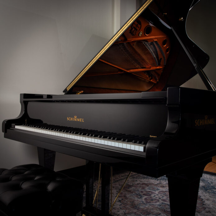 Used Schimmel K-256 grand piano in polished ebony with open lid on display at Miller Piano Specialists showroom in Nashville, TN