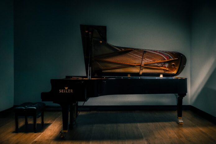 9 foot 2 inch Seiler SE-278 concert grand piano in polished ebony on display with lid open at Miller Piano Specialists in Nashville, TN.