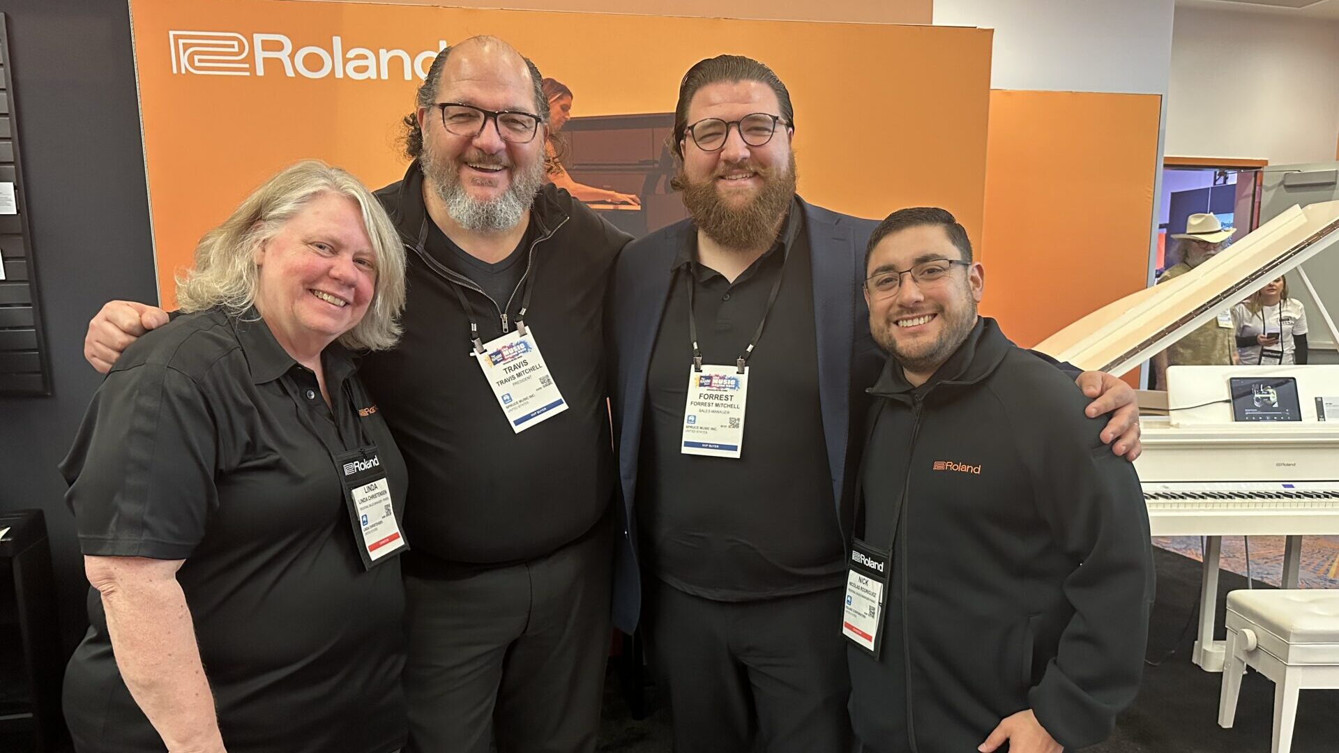 Linda Christensen, Travis Mitchell, Forrest Mitchell, and Nicolas Rodriguez at Roland booth during NAMM 2026