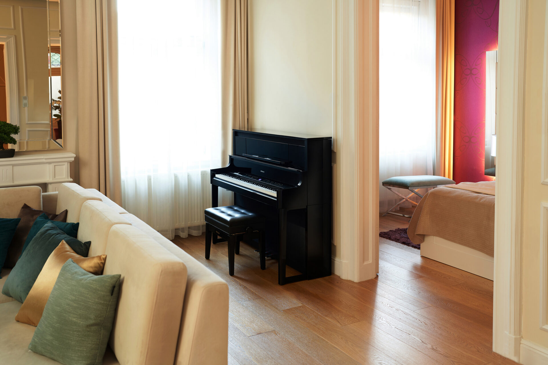Roland LX-9 upright digital piano in polished ebony finish in elegant home interior